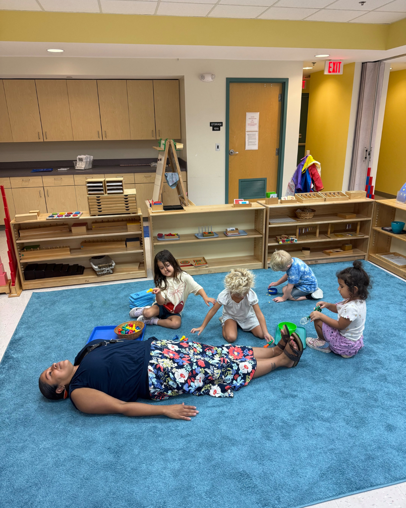 Students measure ELC IA how tall she is.