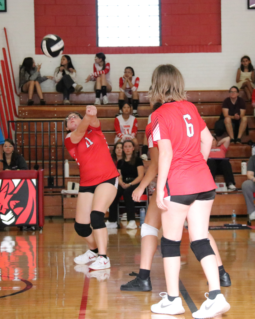 Middl School Volleyball players on the court of Settles Gym. 
