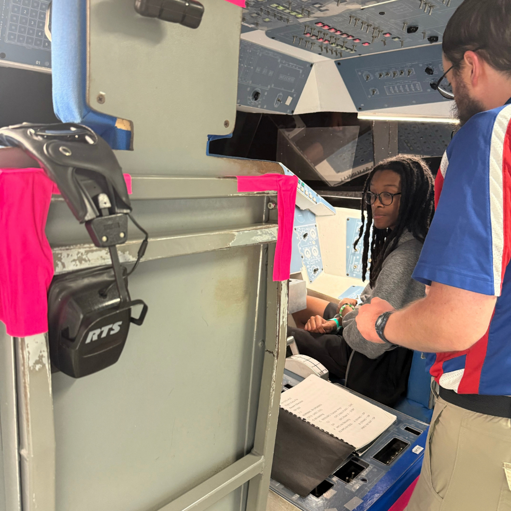 A student listening to an instructor.