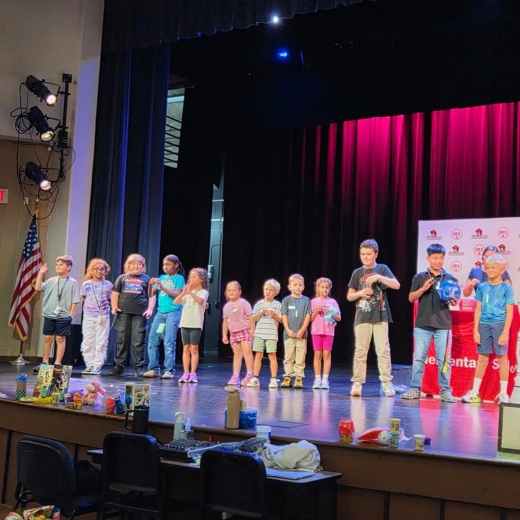 Group of students on stage in Kirk.
