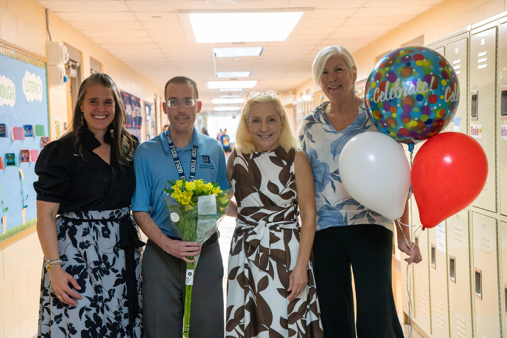 Mr. Ferguson posing with administration.