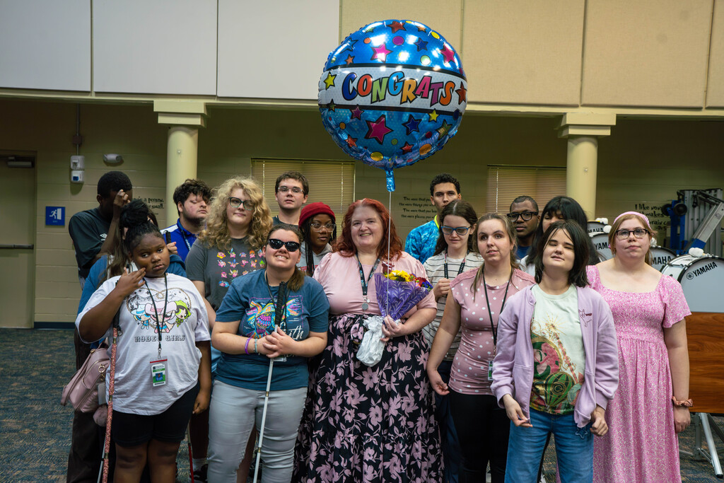 Leslie with the chorus class, who sang to her when she won the award inside Music building. 