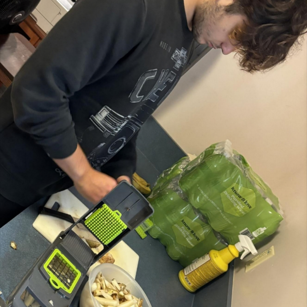 A student learns how to make fries from potatoes.
