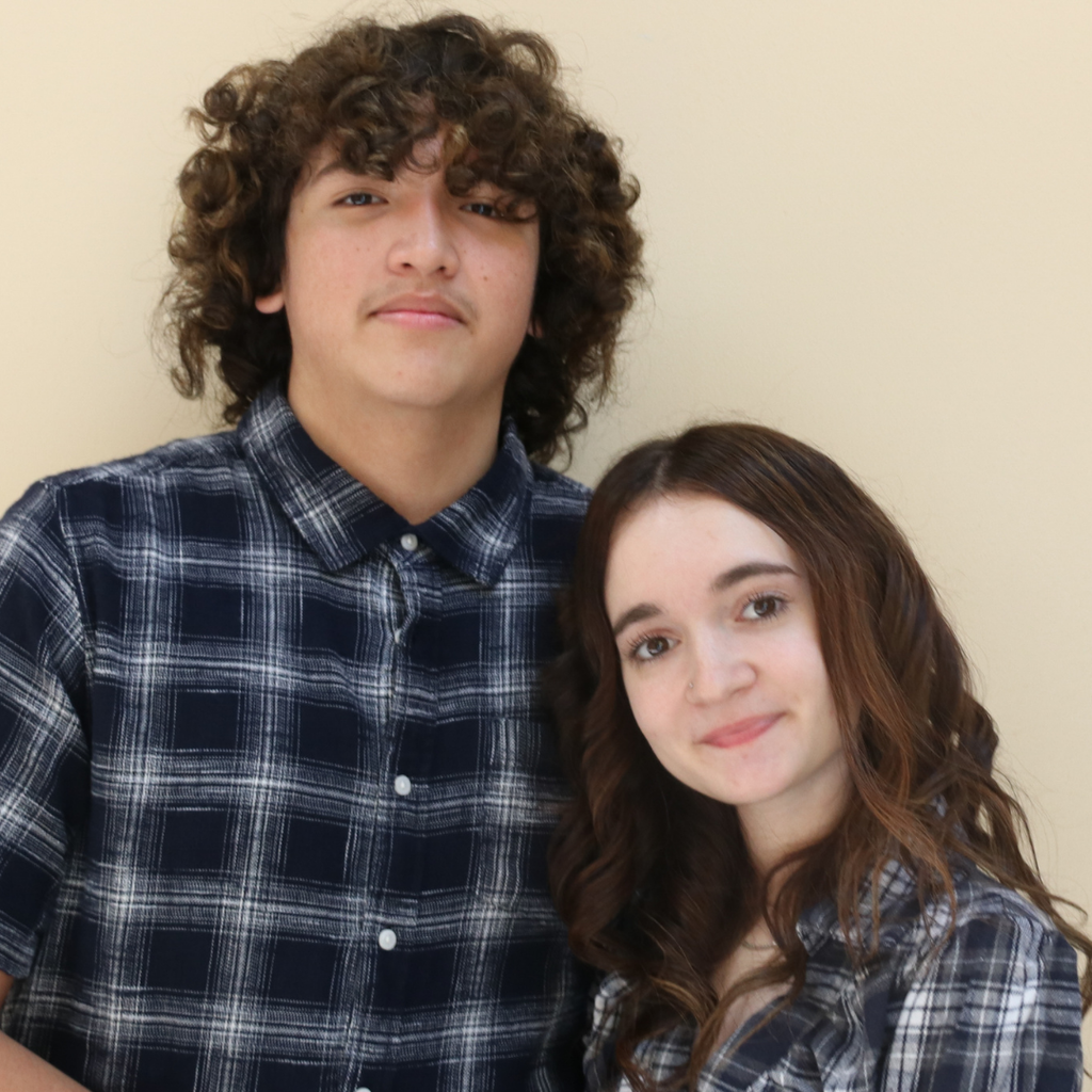Two students match in blue flannel. 