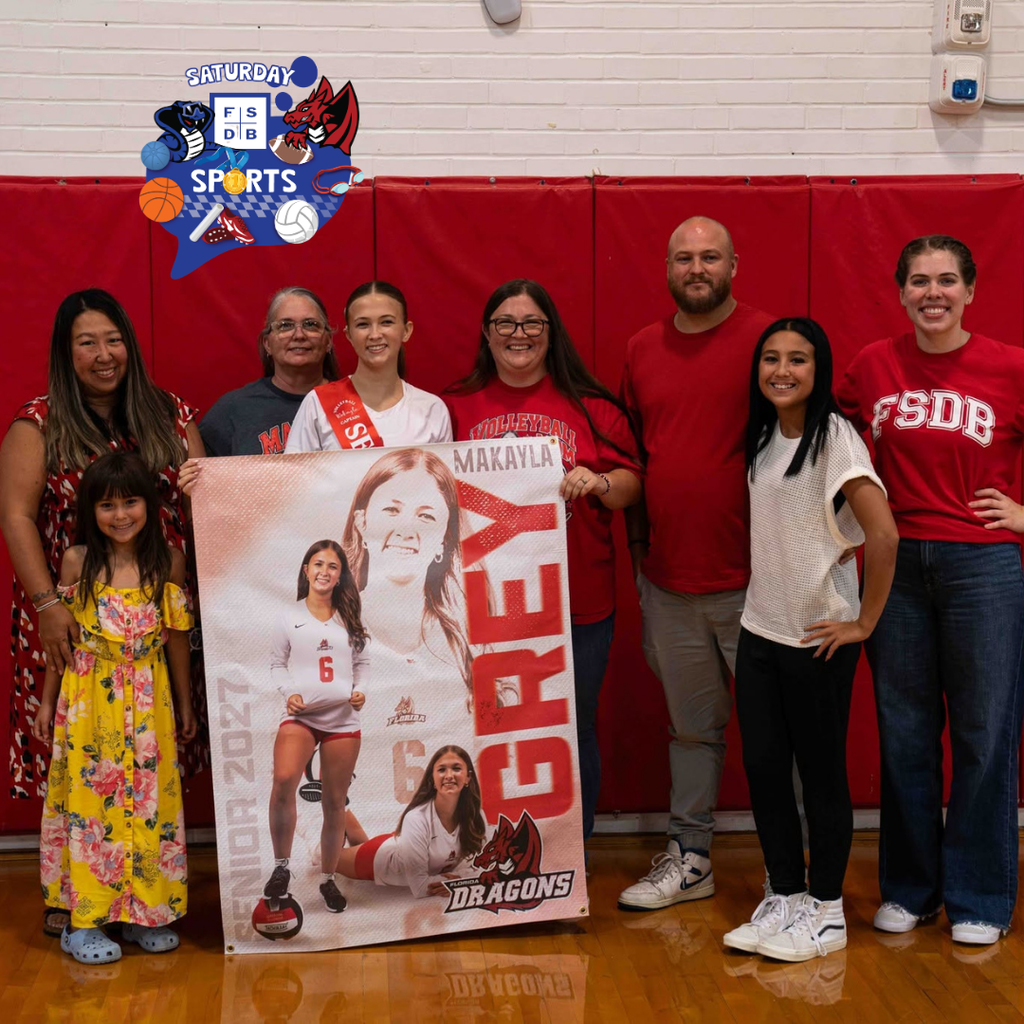 Volleyball senior smile with her family and coach inside the gym.
