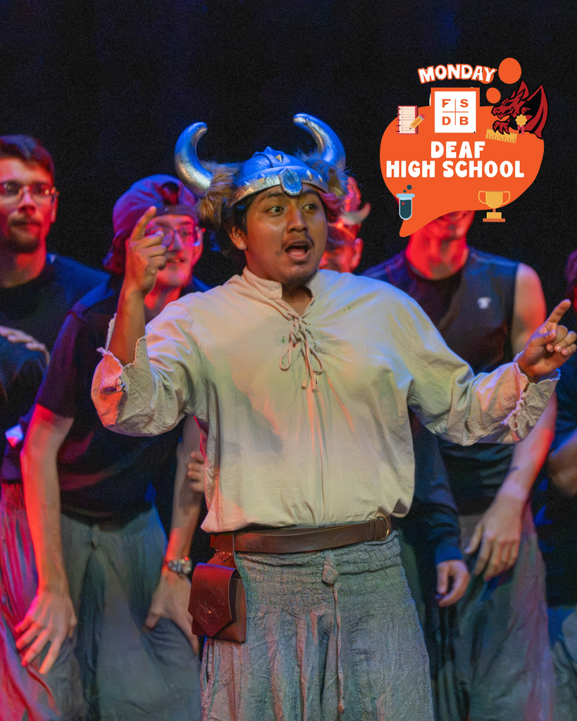 A student dressed as a viking performing his skit on stage. 