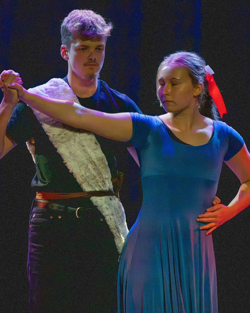 A Dance Troupe couple dance together on stage in Kirk. 