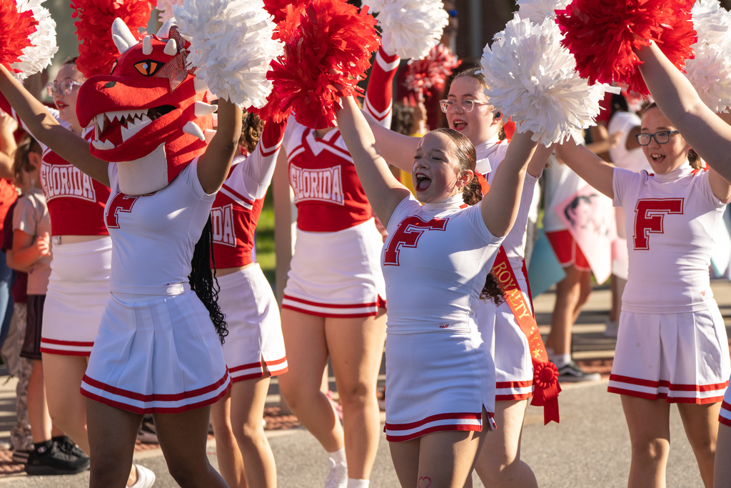 A cheerleader cheers during the parade. 