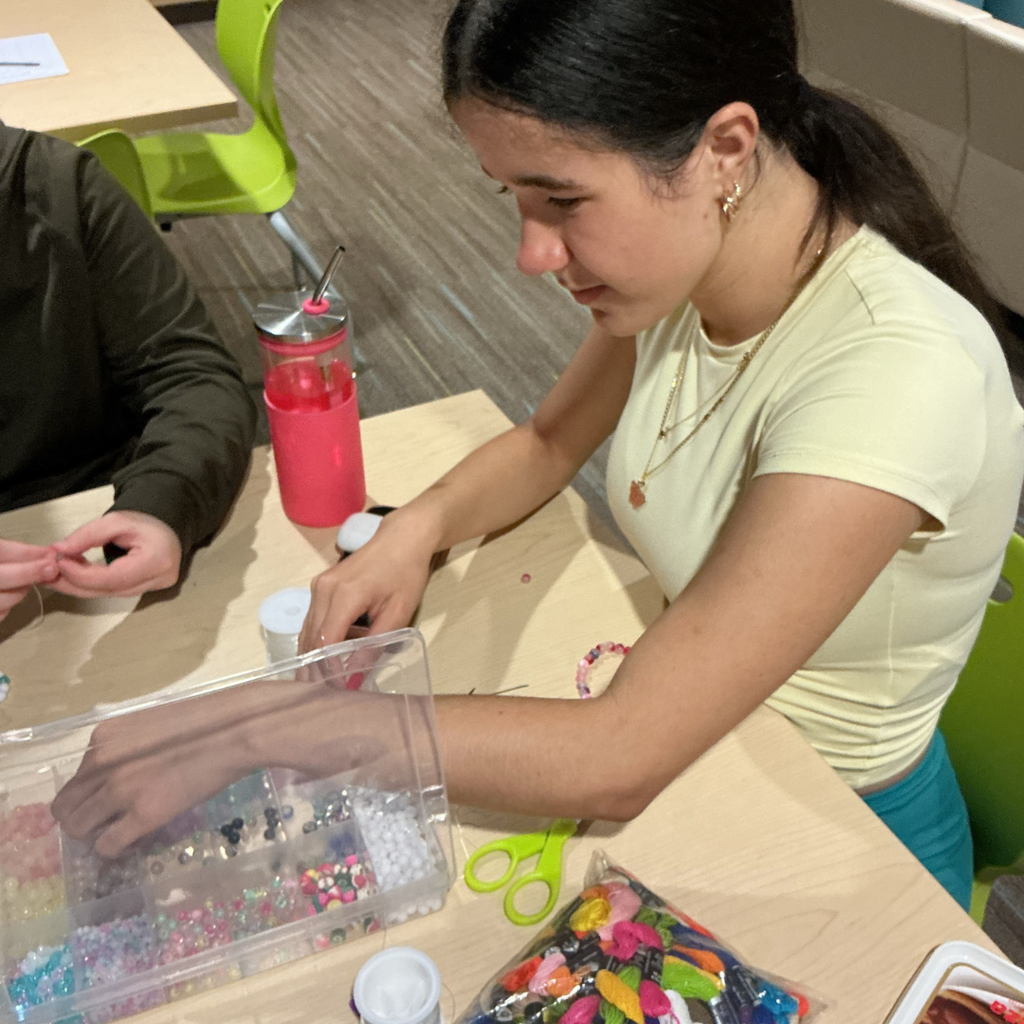 Close-Up of a student working on a craft. 