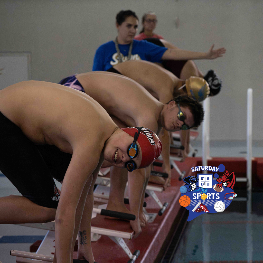 A FSDB swimmer smiles for the camera before he dives into the pool. 
