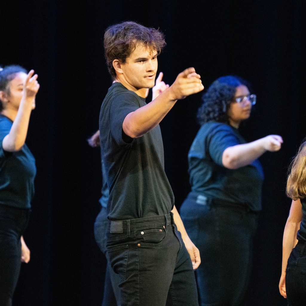 A dance troupe performer on stage. 