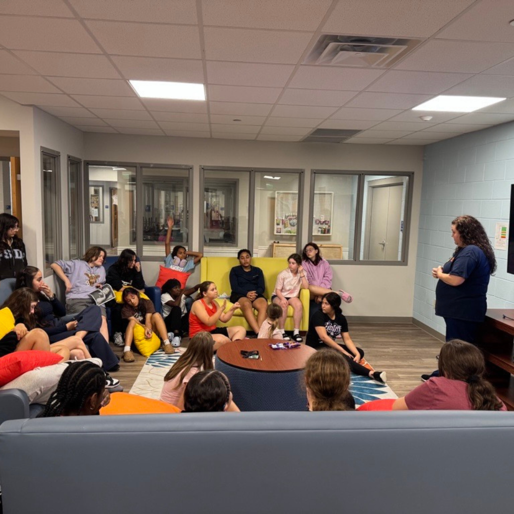 Guest speaker presents to the students in the dorm. 
