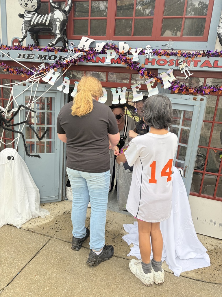 Students trick or treat at Kids Town.