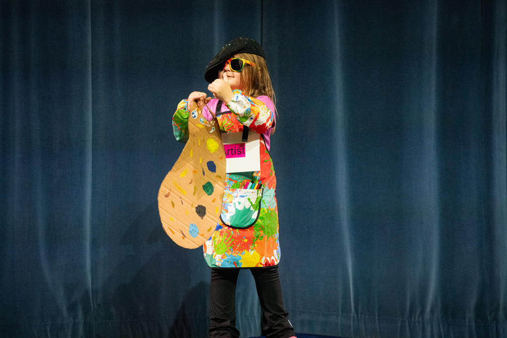 A student dressed colorful like an artist.