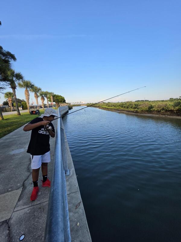 Student fishing off the bulkhead.