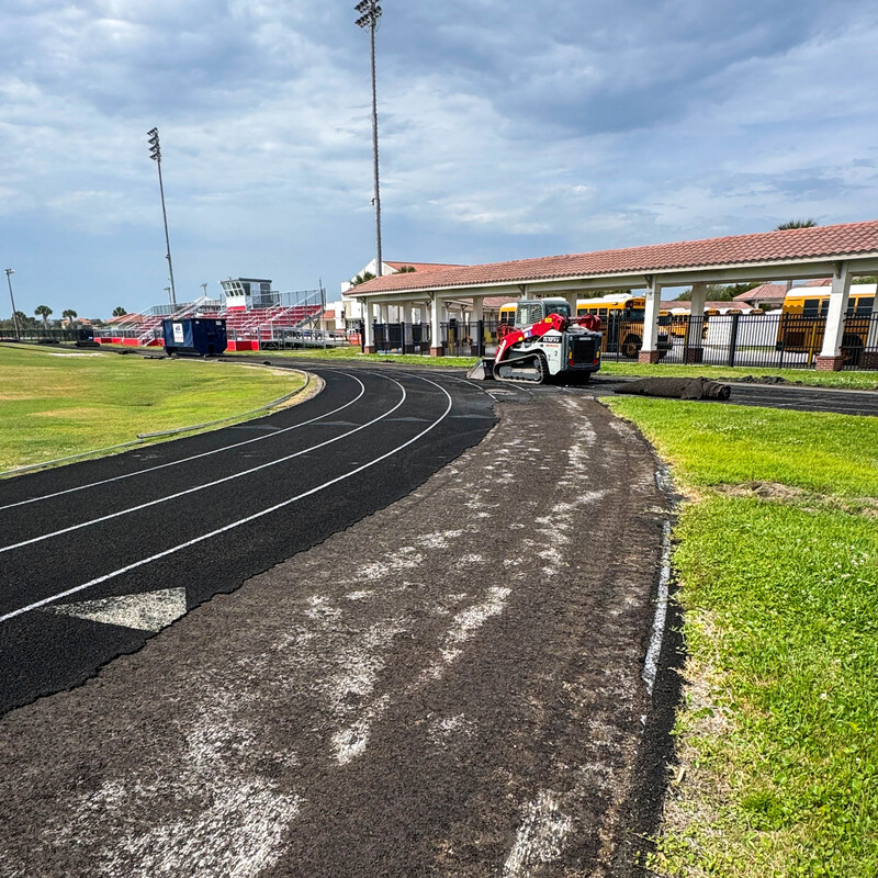 Old track surface being removed.