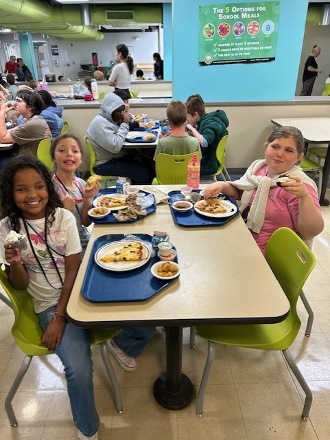 Three girls eating lunch.