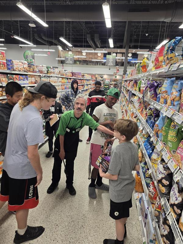 Boys getting a tour in Publix.