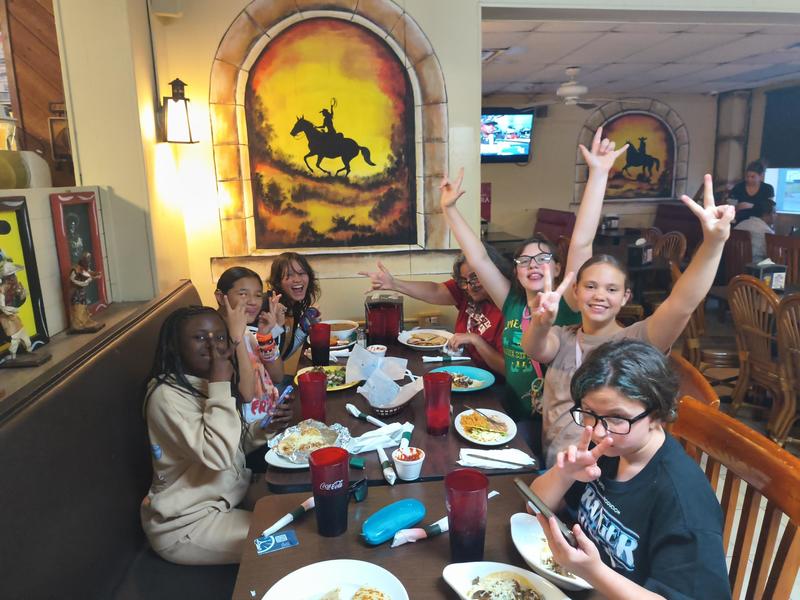 Students eating at a Mexican restaurant.