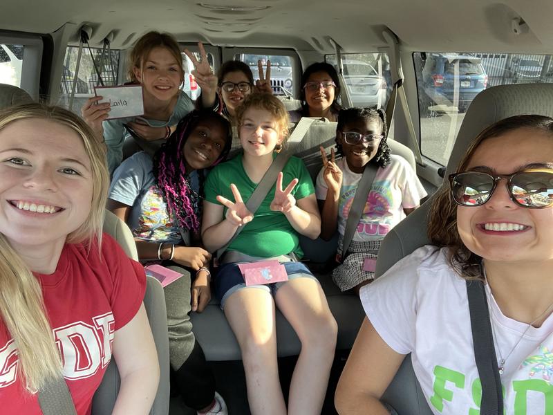 DES girls riding in a van to McDonald's.