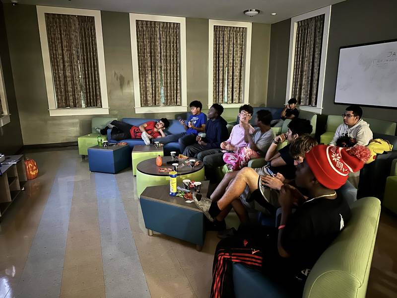 Boys watching a Halloween movie.