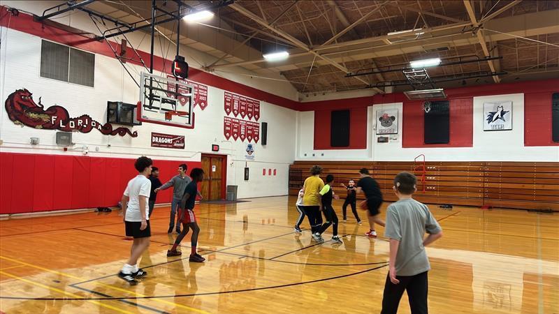 Boys playing basketball in Settles Gym