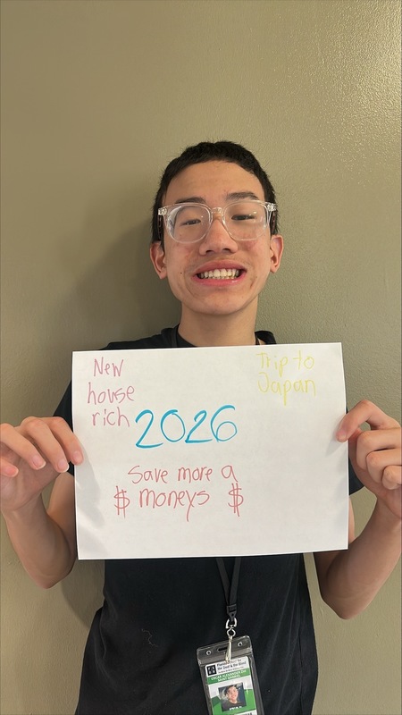 Student holding up 2026 Vision Board