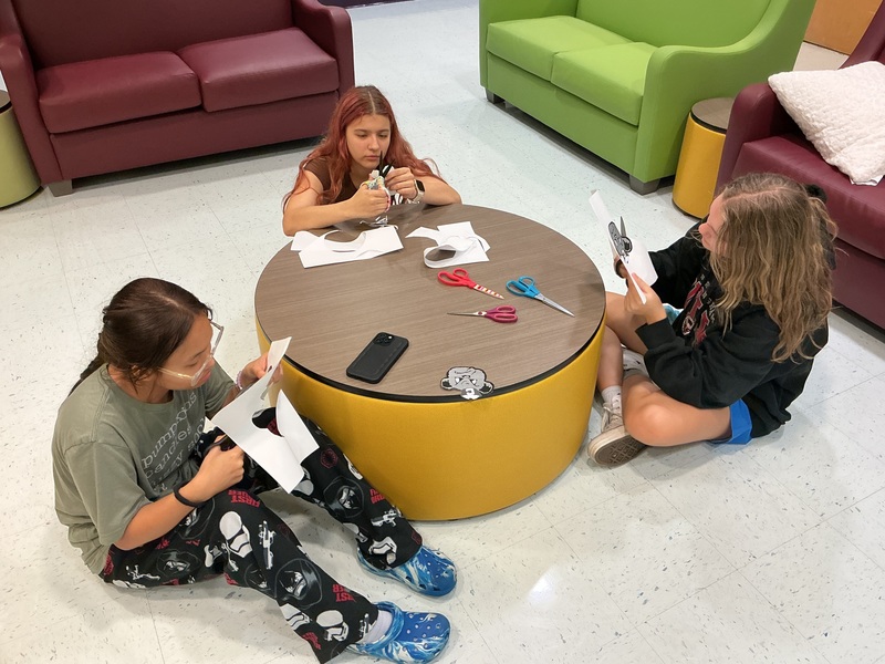 Girls working on Clerc Classic signs
