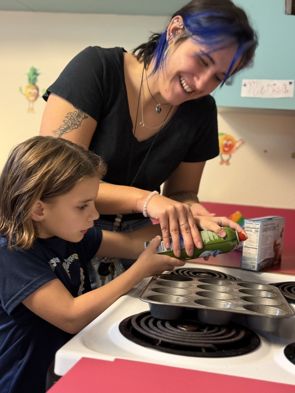 Elementary Student learning how to bake