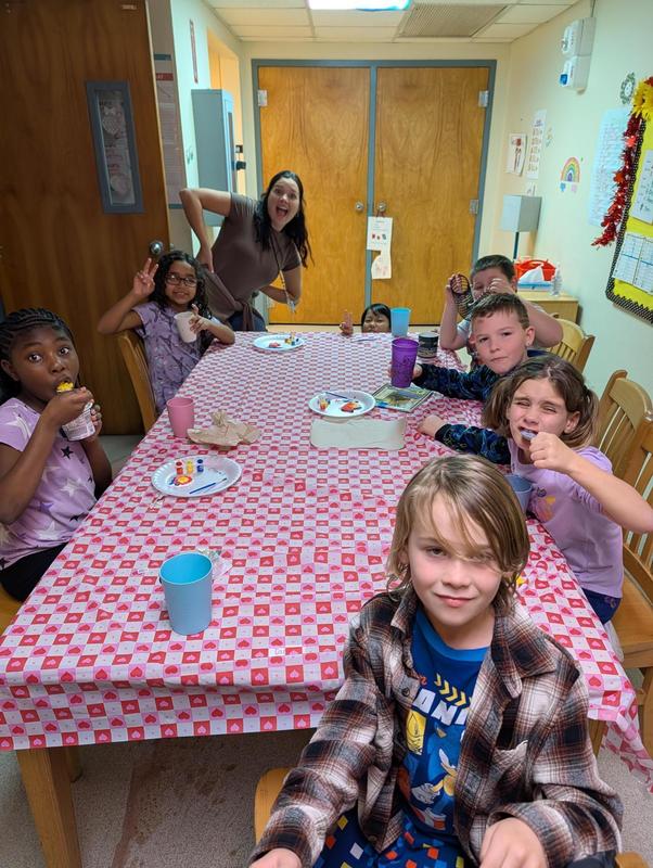 Students sitting at table enjoying food