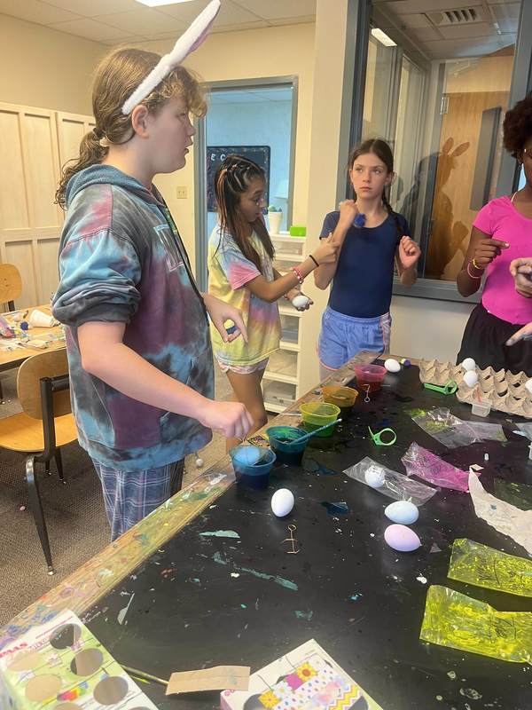 Students coloring Easter eggs