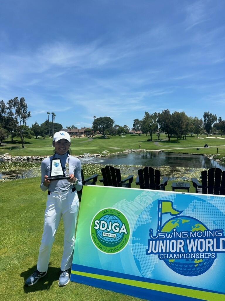 student holding a trophy