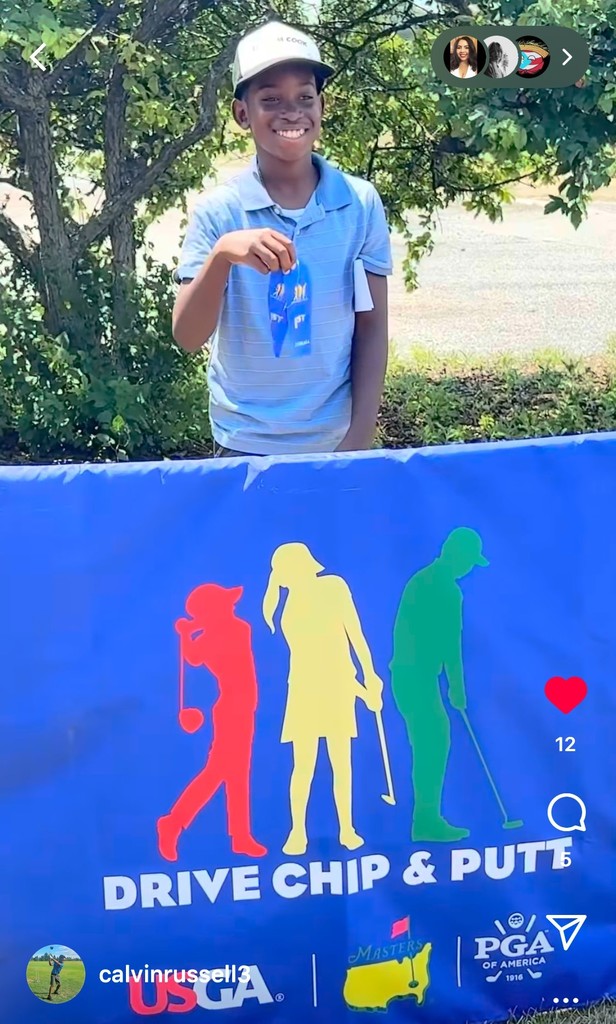 Student holding a medal