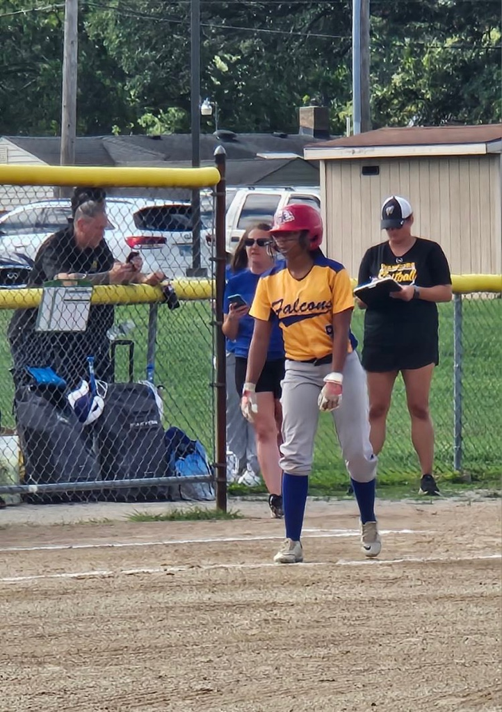 girl pitching a softball 