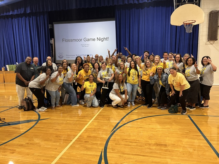 teachers with trophy
