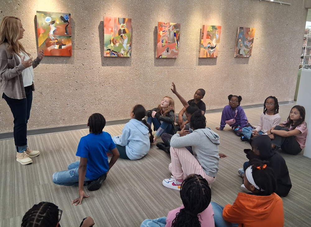 students looking at art