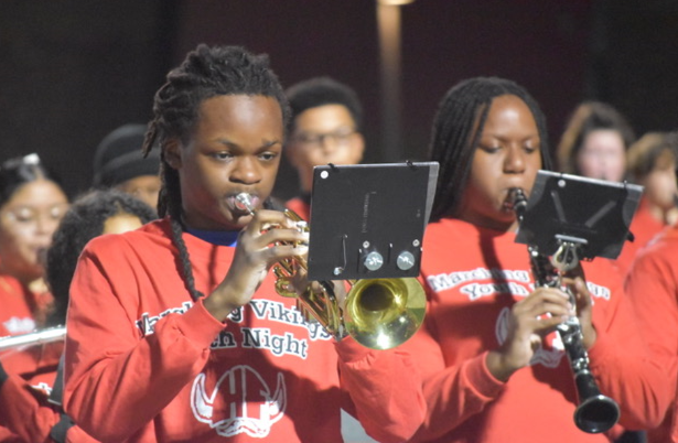 kid playing trumpet