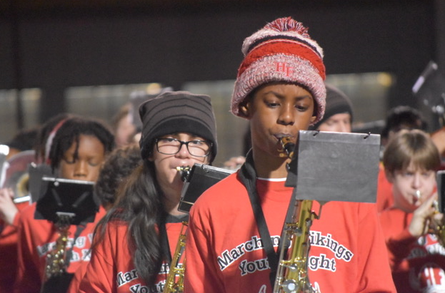 kid playing the sax.