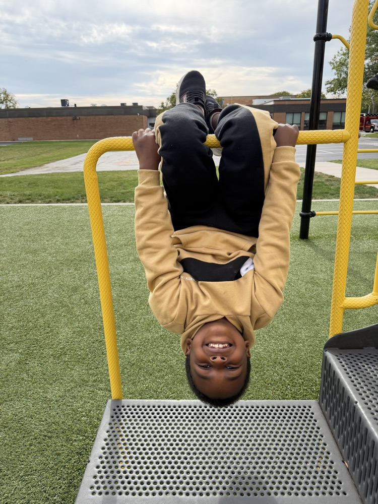 child hanging upside down