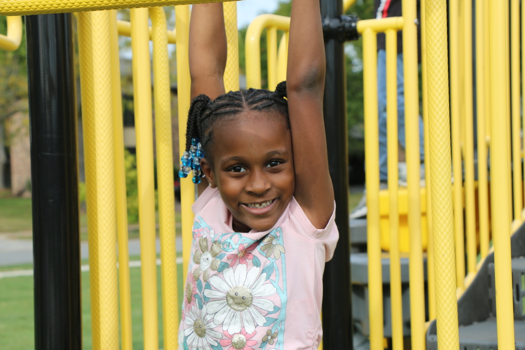 Student on monkey bars 