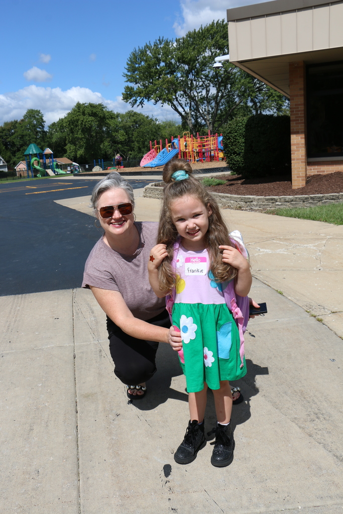 Mom and daughter outside of school