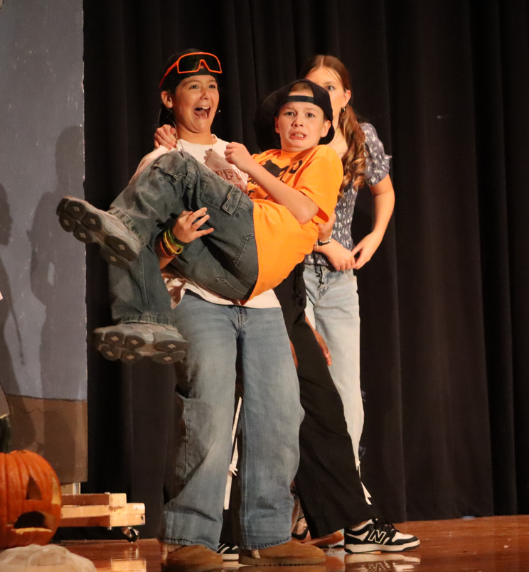 two kids in a scared position. 