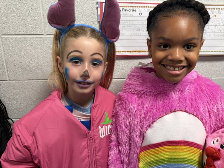 two girls in costumes 