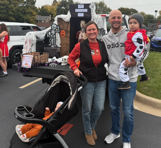 School staff holding children