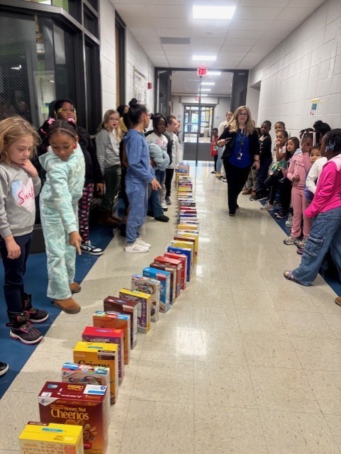 kids with a cereal box 