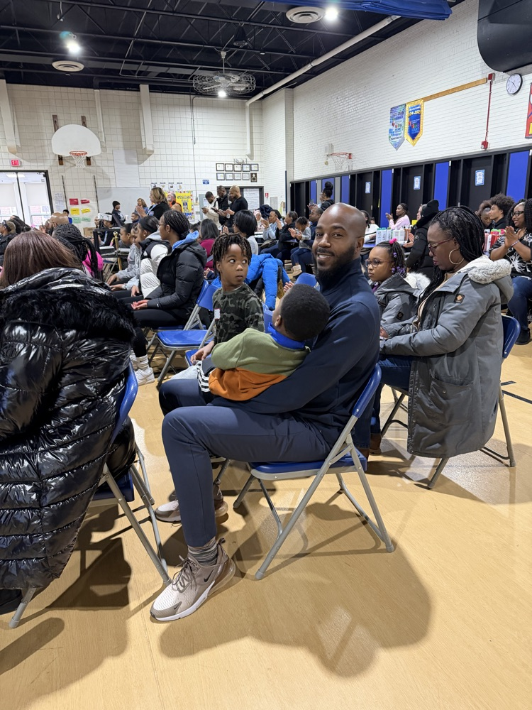 principal sitting with his son. 