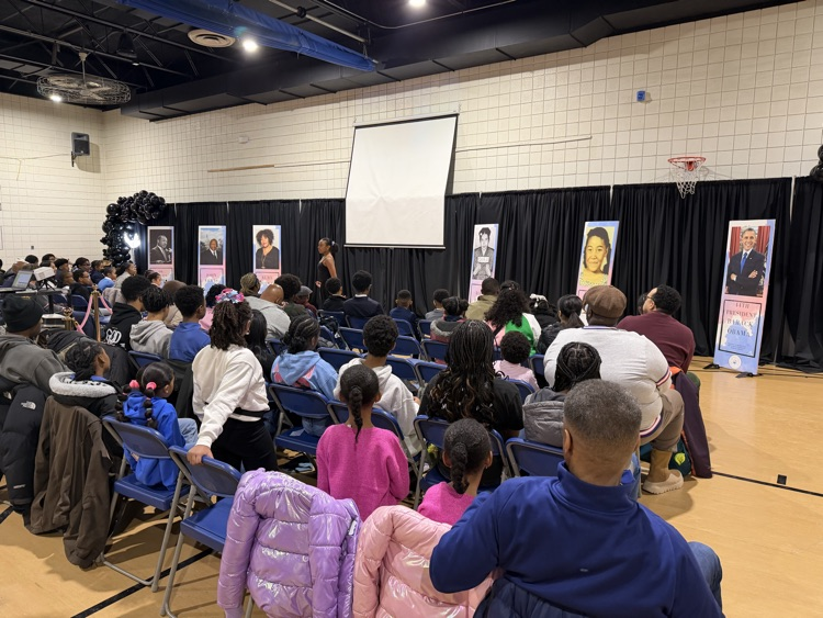 audience members watching a speaker. 