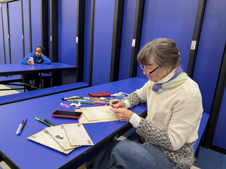 woman writing to service members 