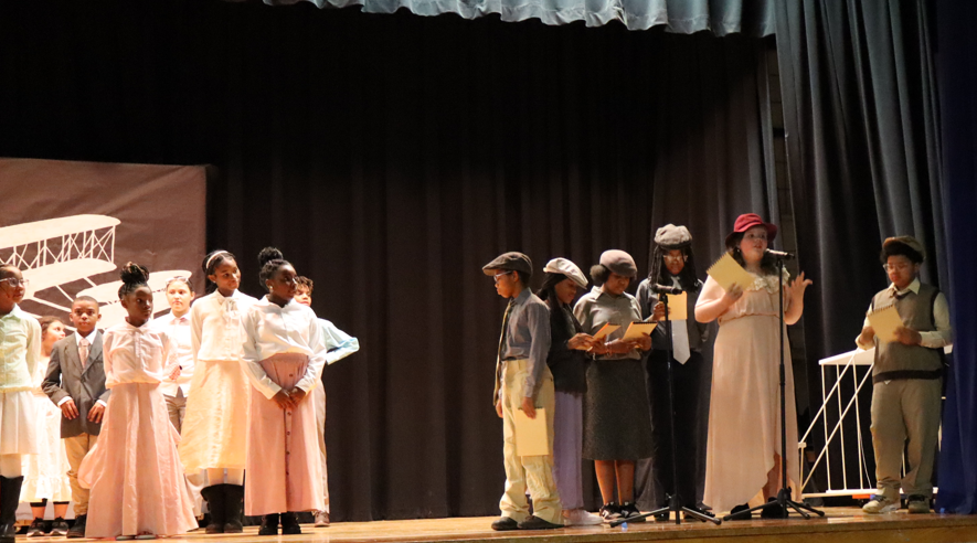 kids on the stage in costumes
