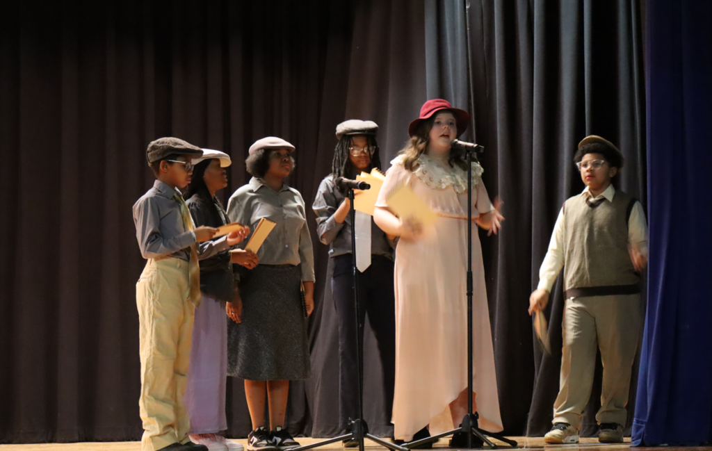 kids singing into a microphone